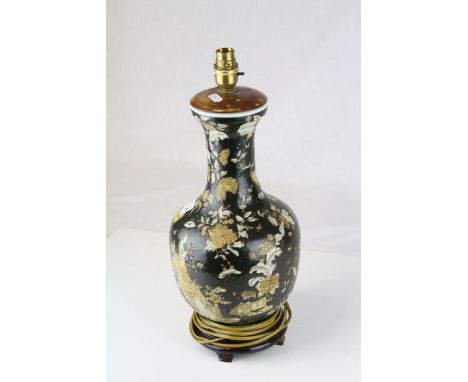 Chinese / Japanese Ceramic Table Lamp decorated with Figures and Text on a Black Ground , 38cms high