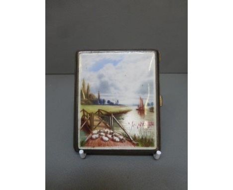 An enamelled silver gilt cigarette case with engine turned decoration, the enamel depicting a boat under sail and a recumbent