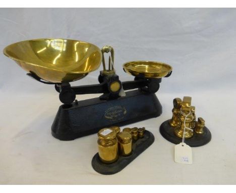 A set of F.J. Thornton and Co. Ltd. 'The Viking' scales and two sets of brass weights with cast metal stands.