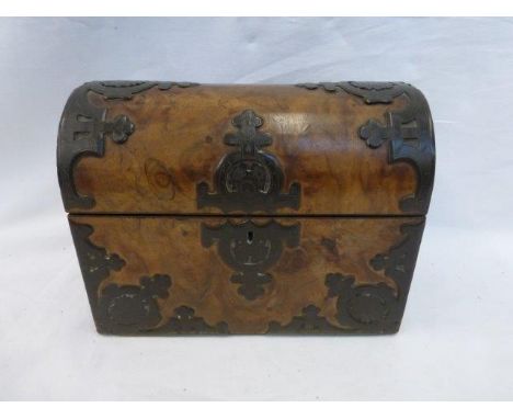 A Victorian walnut and brass mounted dome topped tea caddy with two interior sliding lids each with a brass cartouche, one ma