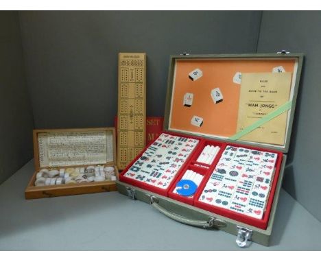 A cased Mah-Jong set, a cribbage board and a Colorito set. 