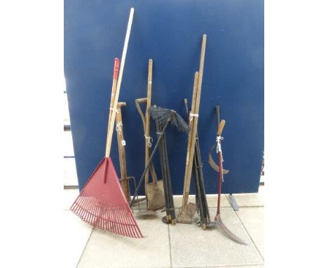An assortment of garden tools, a pull-out awning, a Bosch leaf blower/vacuum and a set of drain rods. 