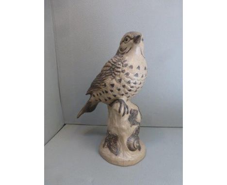 A  Poole pottery model of a song thrush, signed B. Linley Adams.