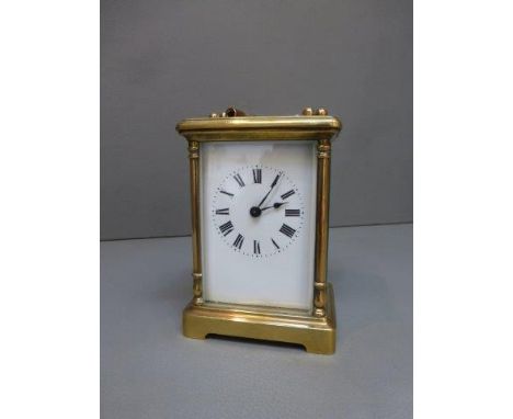 A small brass carriage clock.
