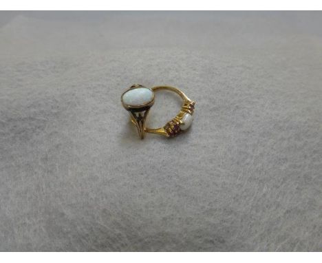 An 18ct gold opal ring, size N and a 9ct gold opal and ruby ring, size N. 