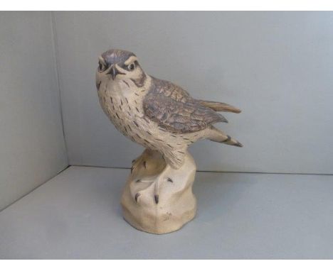 A Poole pottery model of a kestrel signed B. Linley Adams.