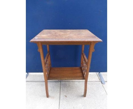 An Arts & Crafts oak lamp table. 