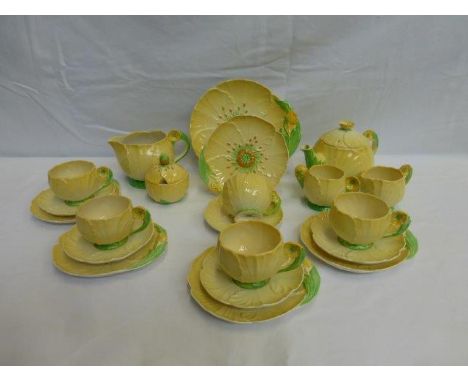 A Carltonware five setting tea/sandwich set decorated with buttercups comprising six cups, six saucers, five tea plates, a sa