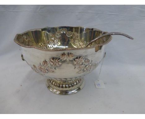 A silver plated pedestal punch bowl and ladle.