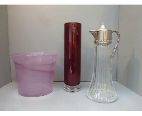 A Scottish Studio glass vase, a ruby glass vase and a claret jug with original label.