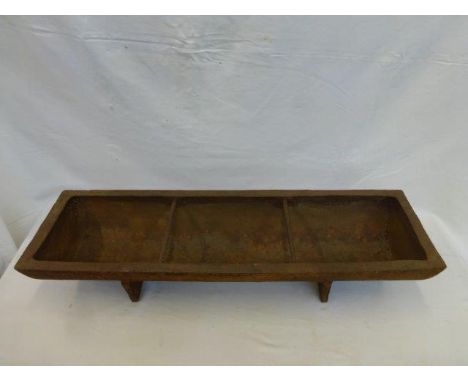 A small cast iron pig trough. 