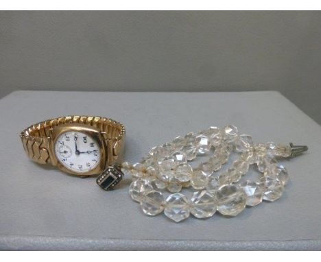 An enamel faced ladies wristwatch and a glass beaded necklace with a silver clasp. 