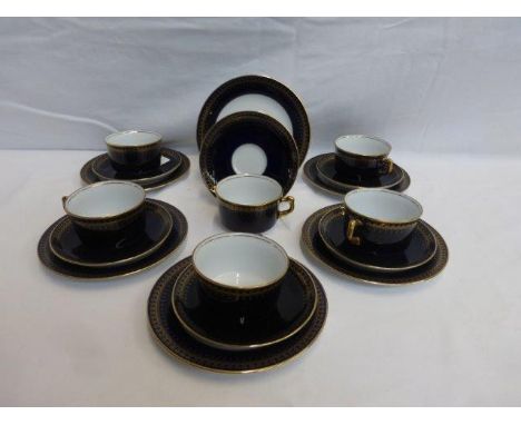 A cobalt blue and gilt decorated six setting coffee set, six cups and saucers and six side plates.