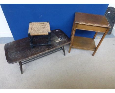 An Art Deco standard lamp, an Ercol coffee table and a tapestry wall hanging/tablecloth.