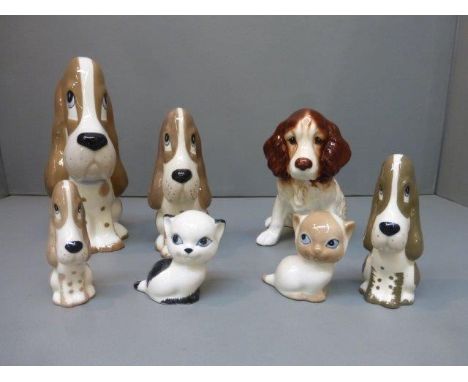 A collection of Szeiler ceramic dog and cat figures and a Sylvac seated spaniel. 