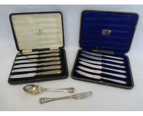 Two cased sets of six table knives, one set with silver handles, and a matching silver spoon and fork set, Sheffield 1898.