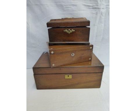 A George III mahogany tea caddy, a Victorian walnut writing slope and one other. 