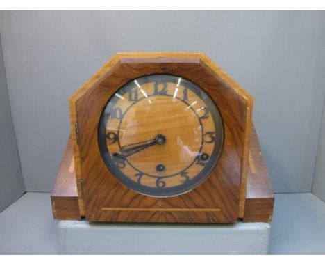 An Art Deco walnut cased mantle clock. 