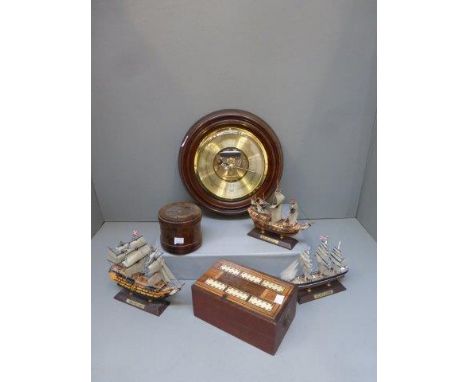 A Russell Norwich circular wooden framed barometer, three model ships, a folding cribbage board and a nautical lidded wooden 