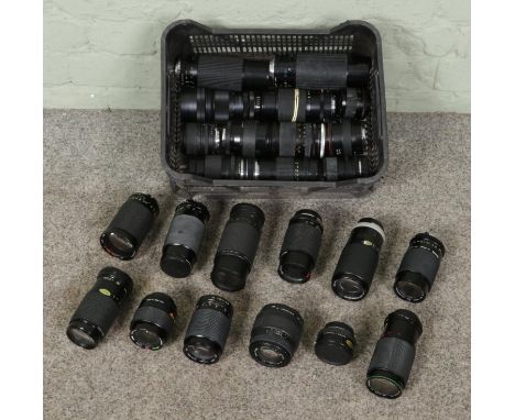 A large collection of assorted vintage camera lenses, comprising twenty-four lenses including Miranda 70-210mm 1:4.5-5.6, Mir