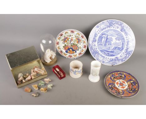 A mixed collection of collectables featuring Wade whimsies, a white coral ornament displayed in a glass dome, a Spode cake pl
