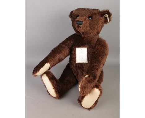A Steiff limited edition British Collectors 1907 Replica jointed Teddy Bear with original white ear tag (no. 406065) and ches