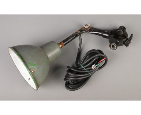 A mid 20th century industrial anglepoise lamp with green enamel shade.