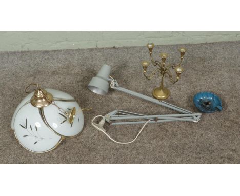 A grey One Thousand and One angle poise lamp along with a floral glass ceiling light and two candlesticks to include brass fi