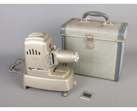 A 1950s Aldis "Aspheric" Slide Projector, with original case with key.  In good working condition.