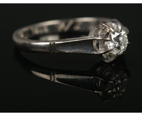 An 18ct White Gold Diamond solitaire ring, with inscription to the inside of the band 'Ronnie to Linda 4/6/70'. Size K½. Diam