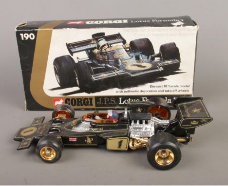 A boxed Corgi 18:1 scale J.P.S (John Player Special) Lotus Formula 1 car with driver.