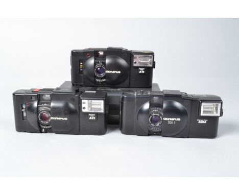 Olympus XA Compact Cameras, an Olympus XA, with A11 flash, XA-1, with A9M flash, XA-2, with A11 flash, in case, with strap an