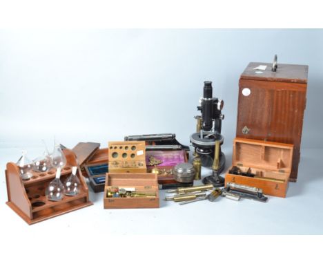 Various Instruments,  Cooke Troughton and Simms black-enamelled and chrome polarizing microscope, with four objectives, in wo