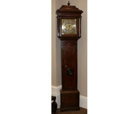 An Oak Eight Day Longcase Clock, caddied pediment, arched trunk door with a later lenticle, 12-inch square brass dial with ch