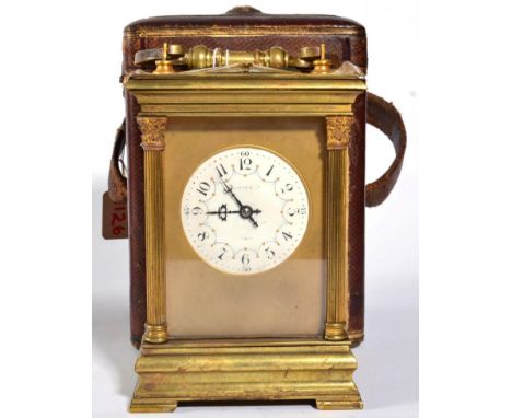 A Brass Striking and Repeating Carriage Clock, retailed by Gibson & Co, Paris, circa 1900, carrying handle and repeat button,