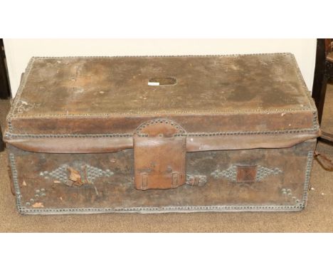 A George III Leather and Brass-Studded Trunk, with brass plaque engraved CAPTAIN CARR, WEST-YORK, with hinged lid and iron si