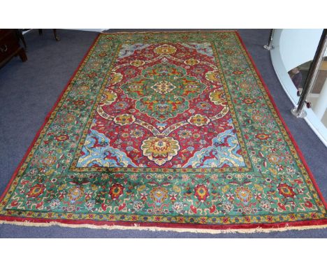 Very Finely Woven Petag Design Carpet, 20th century The raspberry field centred by a cusped apple green medallion enclosed by