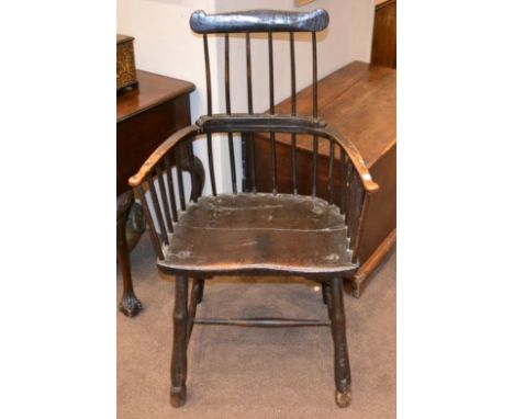 An 18th Century Elm and Painted Comb-Back Armchair, with double spindle back support above a moulded seat, the legs joined by