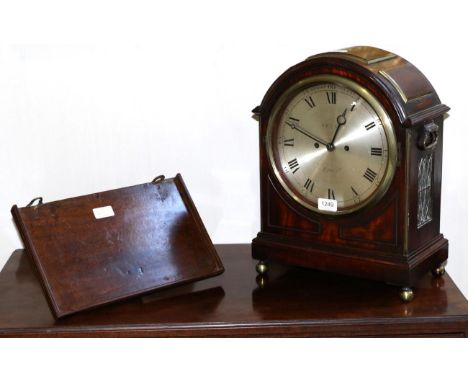 A Mahogany Striking Table Clock, triple pad pediment, side carrying handles and pierced sound frets, brass ball feet, 9-inch 