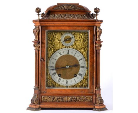 A Burr Walnut Quarter Striking Table Clock, circa 1890, the walnut veneered case with a caddied pediment, floral and scroll g