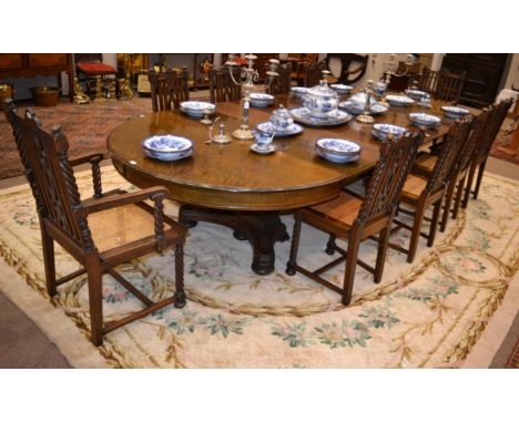 An Early 20th Century American Oak Extending Dining Table, stamped Berkey & Gay, with seven additional leaves and D shaped en