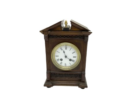 Edwardian - 19th century French 8-day walnut cased mantle clock, with a broken pediment and brass acorn finial, reeded pilast