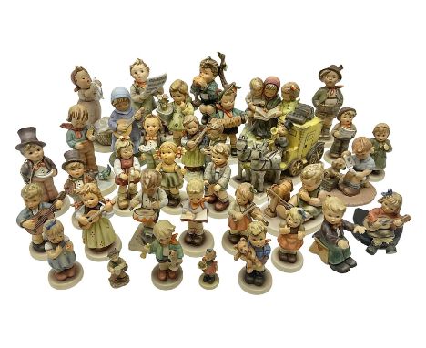 Thirty four Hummel figures by Goebel, to include Harmony &amp; Lyric, Clean Bill of Health, Bird Watcher, An Apple a Day, Lam