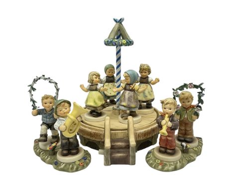 Hummel by Goebel, Sounds of Spring collectors set, eleven piece set comprising  turntable maypole stand, two smaller stands a