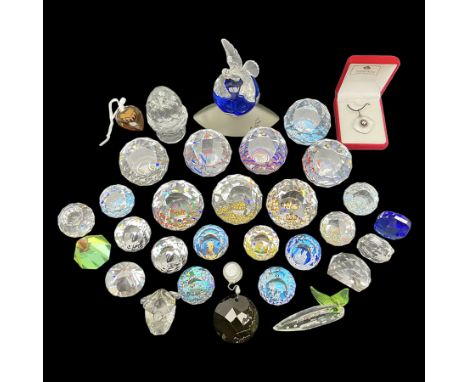 Swarovski Crystal paperweights, to include a globe with dove to the top, pyramid shapes etc, together with a large collection