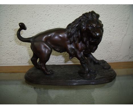 19th/20th bronze figure of a lion fighting serpent (14cm high)