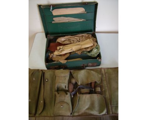 Canvas bound leather workers tool roll with a large selection of various tools and accessories and a suitcase containing a se