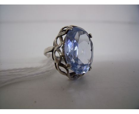 Silver dress ring set with large faceted stone 