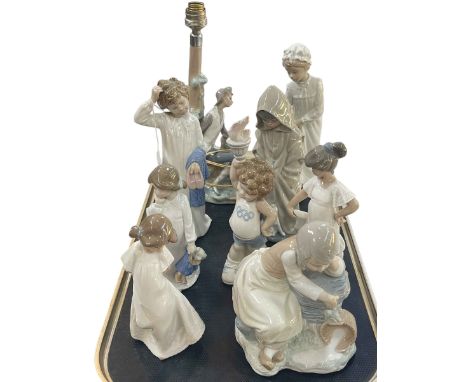 Lladro lamp and figure and seven Nao figures.