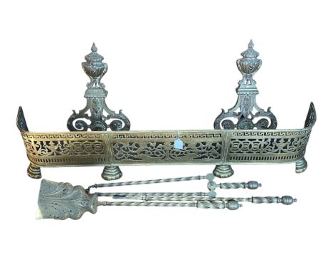 Victorian pierced brass fender, pair of large brass fire dogs and set of three fire irons.